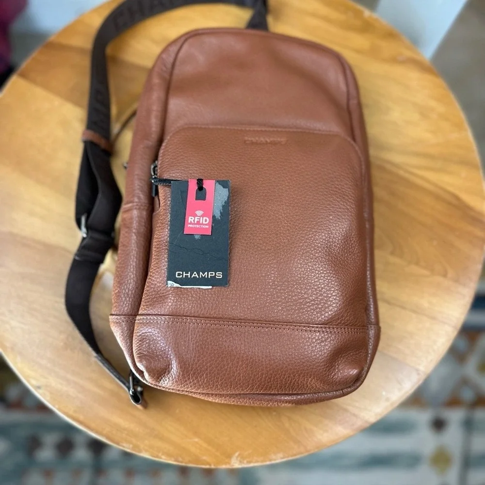 Champs NWT Onyx Brown leather sling Bag w adjustable Strap and Minimalist Design